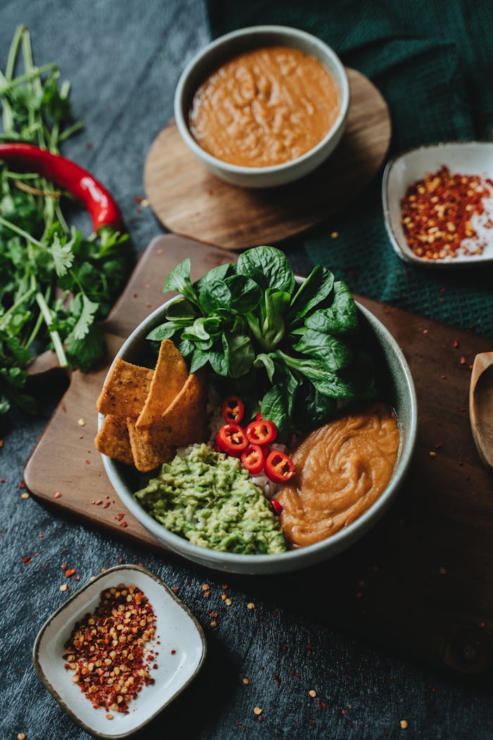 Vegan bowls with avocado and spicy salsa, perfect for healthy eating and food photography.